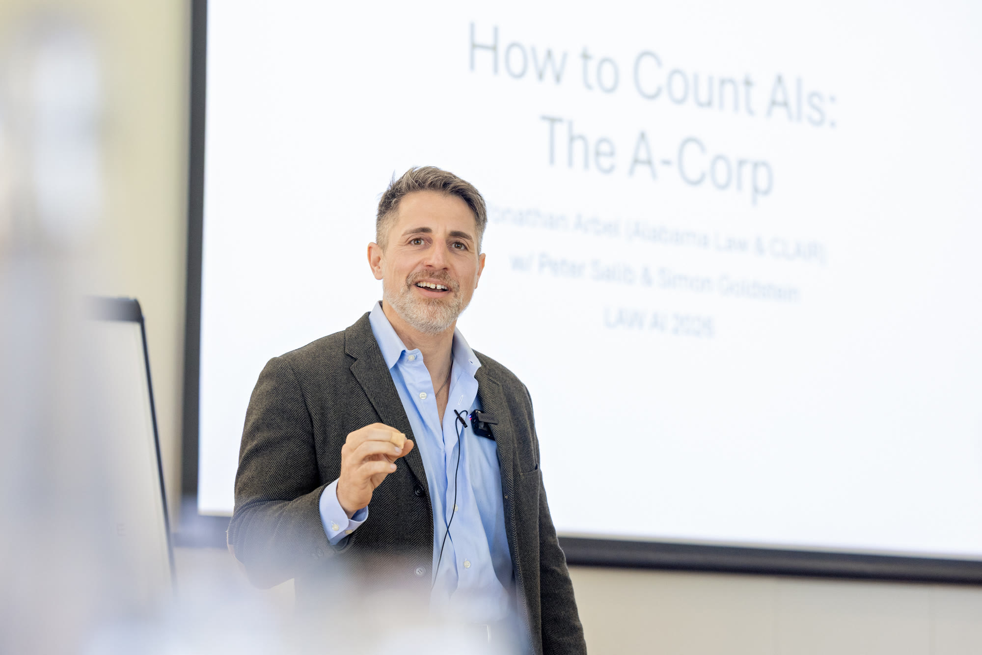 Yonathan Arbel presenting How to Count AIs at the 2026 Law-Following AI Workshop