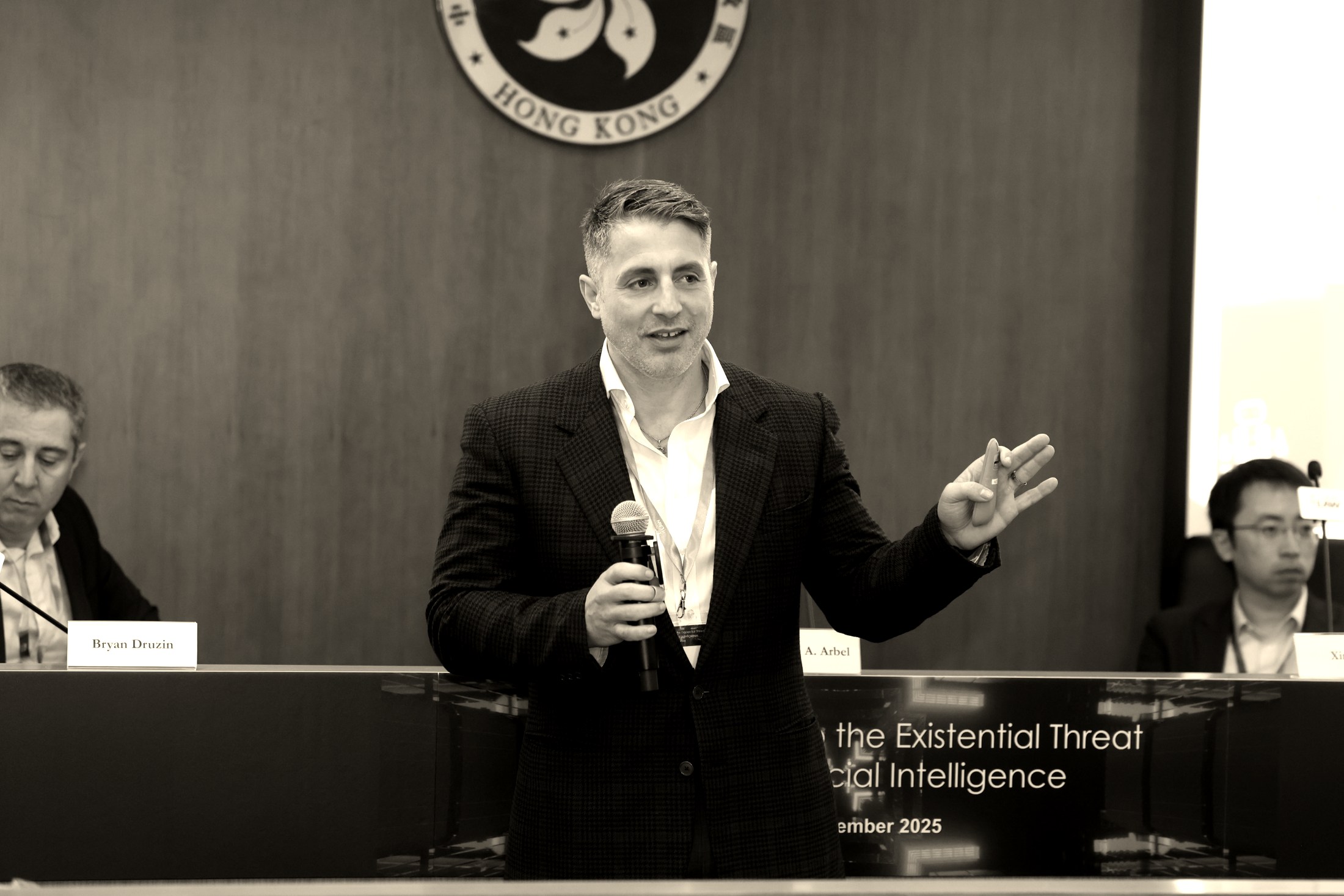 Yonathan Arbel speaking on a panel at a conference in Hong Kong